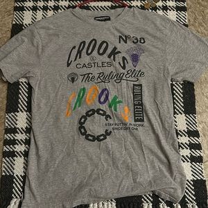 Crookston castles gray shirt with print on the front back is plain light gray